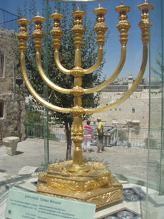 The Golden Lampstand which was present in old temple but damaged, was restored to its original form, kept outside the temple area.